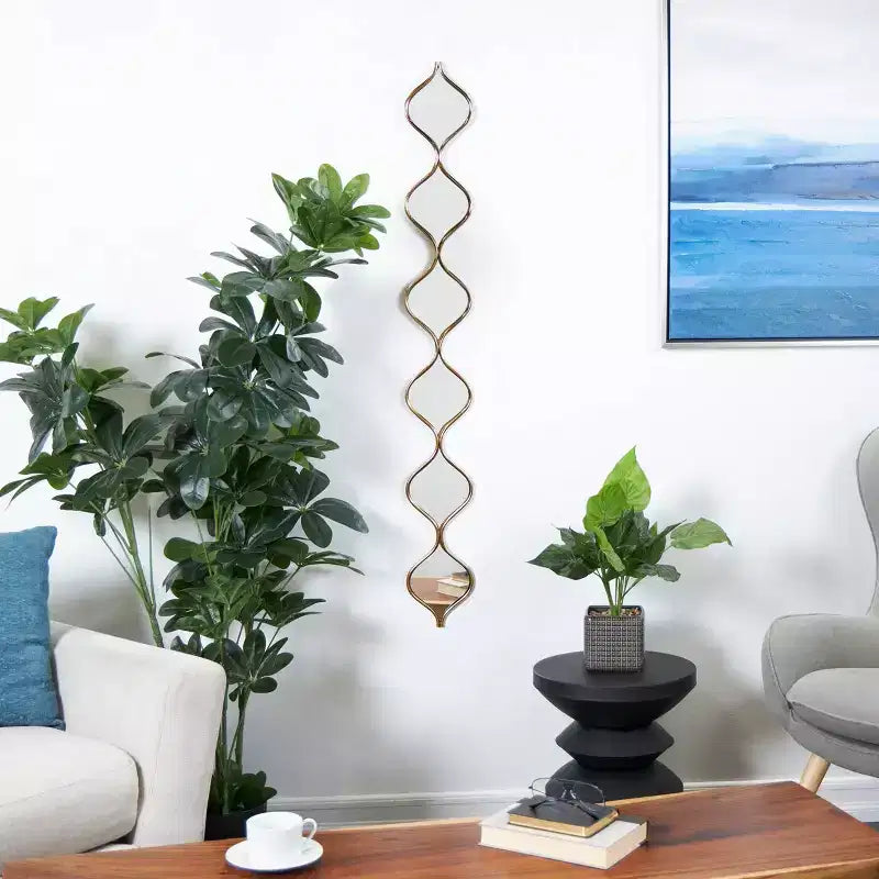 Miroir mural empilable fin en métal de 130x15 cm avec 6 couches et motif en forme de goutte d'eau, doré